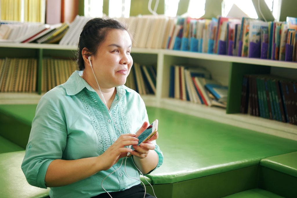 Image of woman with vision impairment using a phone